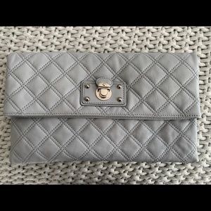 Authentic Marc Jacobs clutch/handbag. Quilted grey with silver hardware.